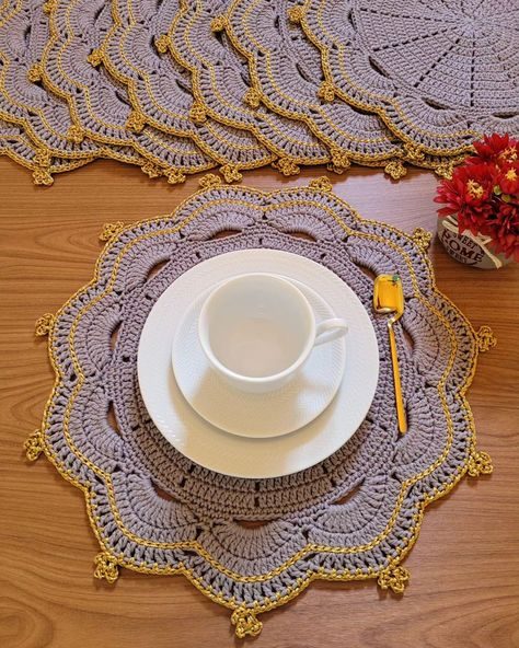Dining table with crochet table decorations, antique wood buffet, floral lace, warm candle lighting.
