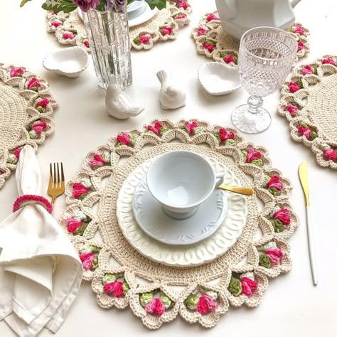 Coffee table with colorful crochet doilies, rattan furniture, plants, natural sunlight, terra-cotta tones.