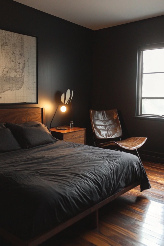Dark bedroom featuring a dark wood bed, leather reading chair, and a vintage world map wall art.
