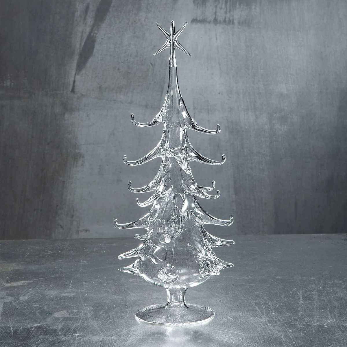 Sunlit open shelving unit with aquamarine crystal trees, driftwood, white ceramic vase, and soft natural ambient light.