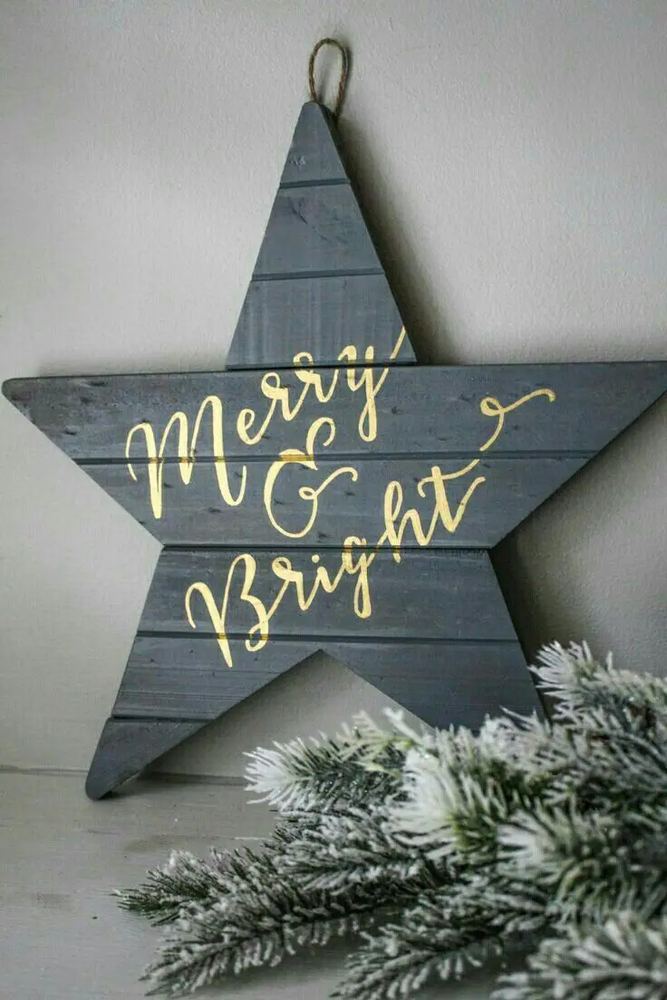 Elegant fireplace mantel styled with brass wire diy christmas star decorations, velvet ribbon, and warm candlelight