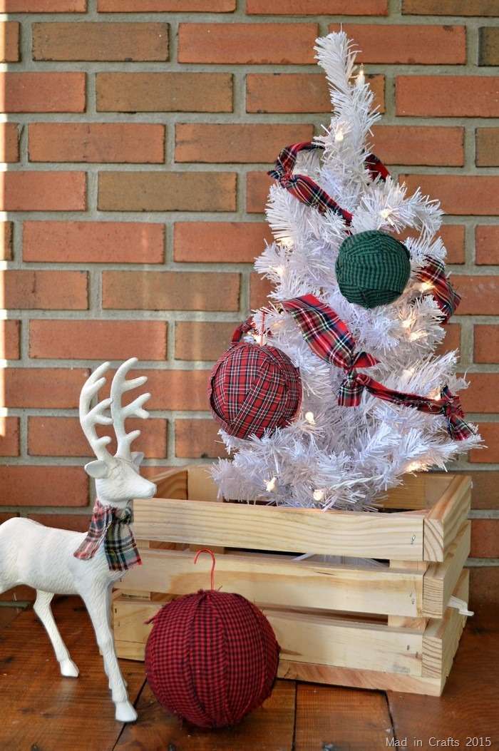 Designer holiday tree decorated with plush sage green velvet wrapped diy christmas tree balls and faux pearl strings.
