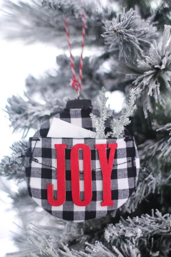 Traditional holiday tree with vintage sheet music decoupaged diy christmas tree balls finished with aged bronze ribbon.