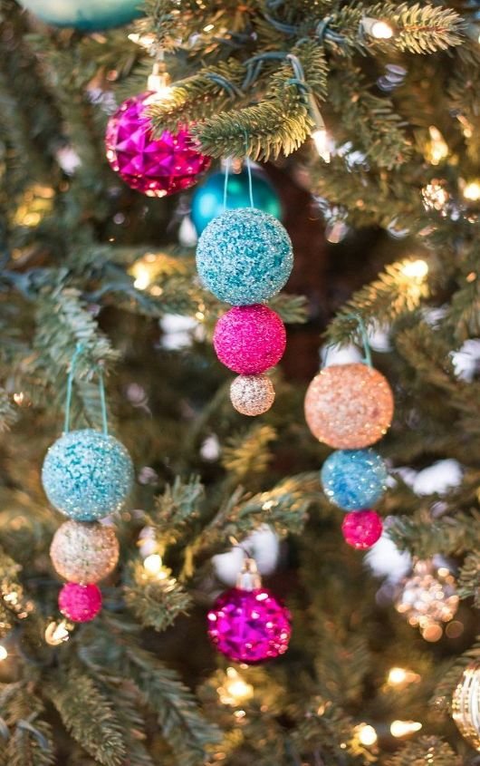 Sunlit sunroom Christmas tree with transparent pressed floral diy christmas tree balls oak wood bench