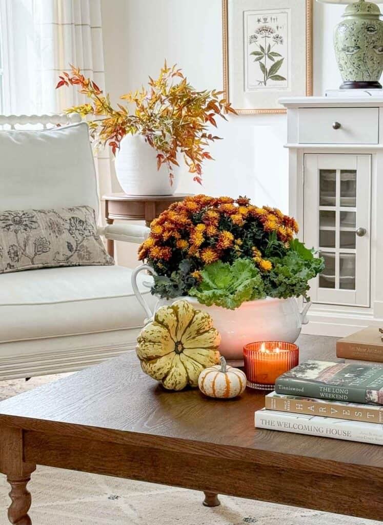 An entryway bench with a wool throw and a pair of leather boots.