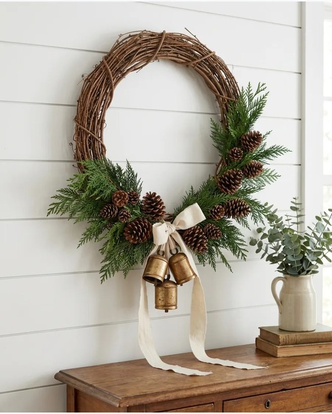 Farmhouse bells wreath on wood door with burlap ribbon