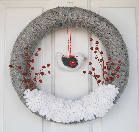 Cozy front porch decor featuring handcrafted yarn wrapped wreath with felt winter bird accents.