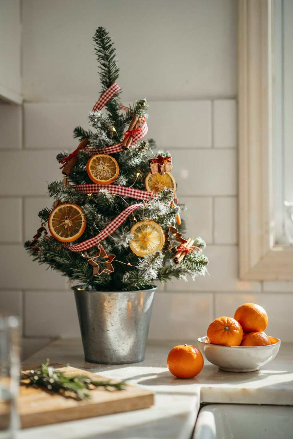 Glass jars filled with pinecones, berries, wood countertops, farmhouse kitchen, soft glow.