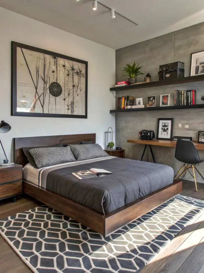 Bedroom featuring floating wooden shelves positioned above a low platform bed, creating functional display space.