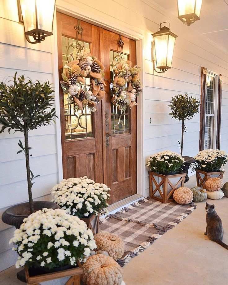 Front porch with black metal chairs, brass coffee table, and amber LED strips