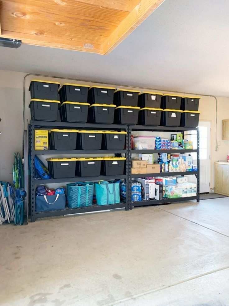 garage with industrial steel racks, black powder coat, wooden planks, bright overhead lights