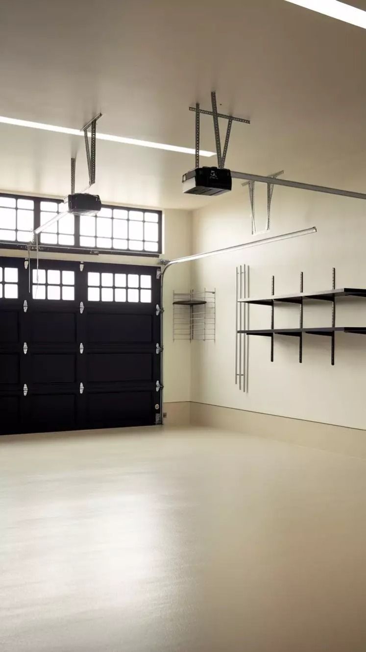 garage with floating shelves, black metal brackets, pine wood boards, warm white lighting