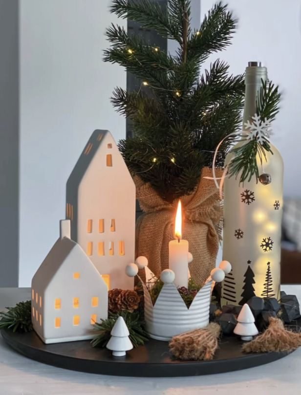 Long pine garland acting as a table runner with scattered gold ornaments.