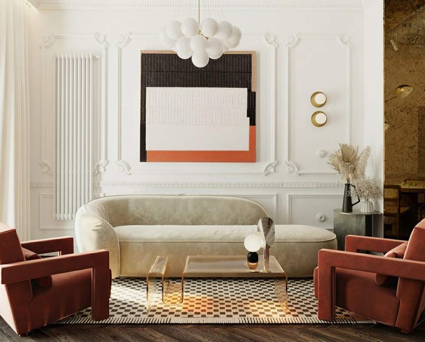 Bronze leaf pattern mirror, neutral sofa, wood floor, and warm living room light.