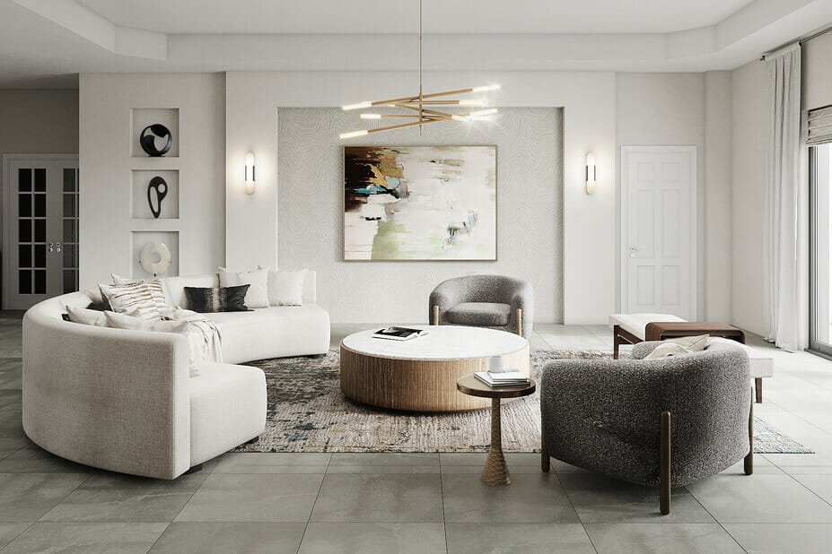 Amber glass chandelier, neutral sofa, white walls, and warm living room light.