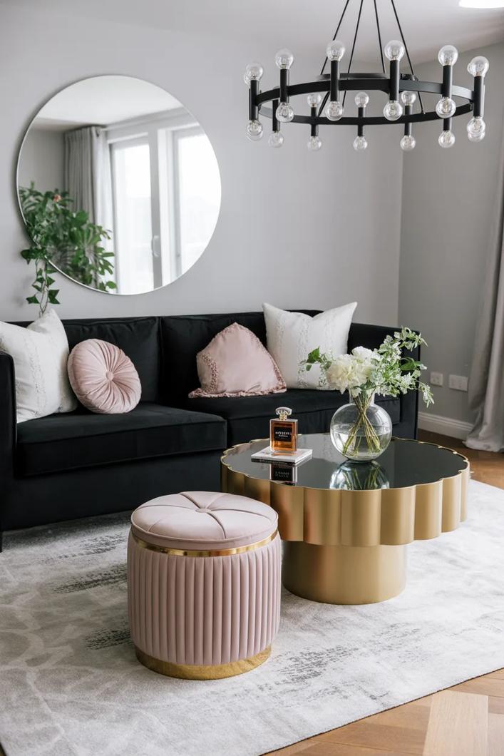Bronze coin decor, neutral sofa, wood floor, and warm living room light.