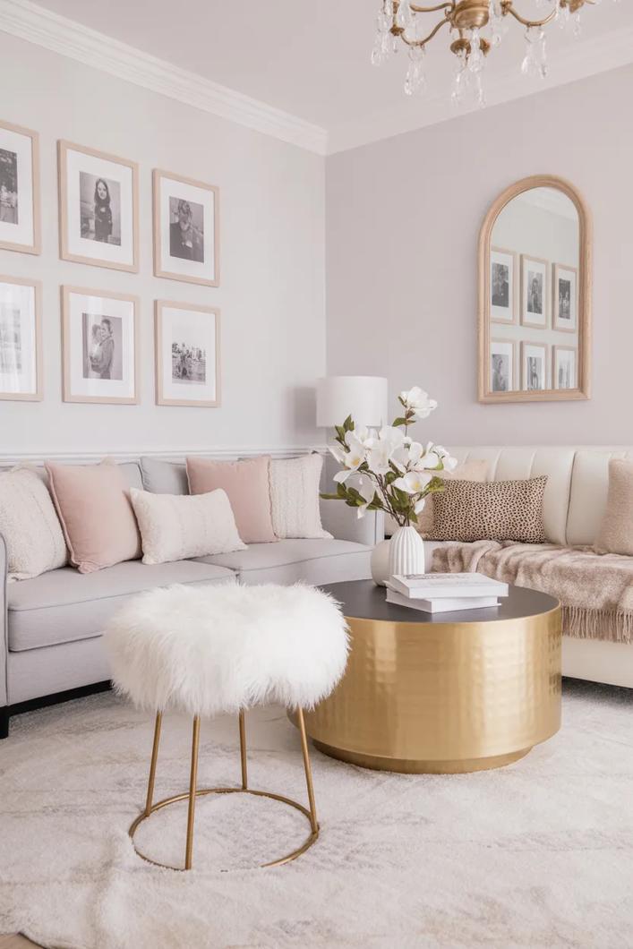 Blush pink silk curtains, neutral sofa, white walls, and soft living room light.