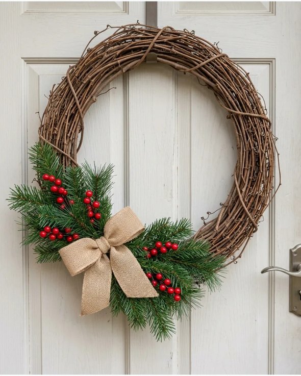 Grapevine berry wreath on white wall with natural light
