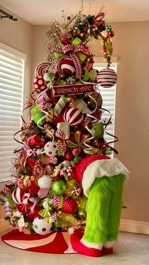 Tree with a Joy sign on a staircase in a bright room