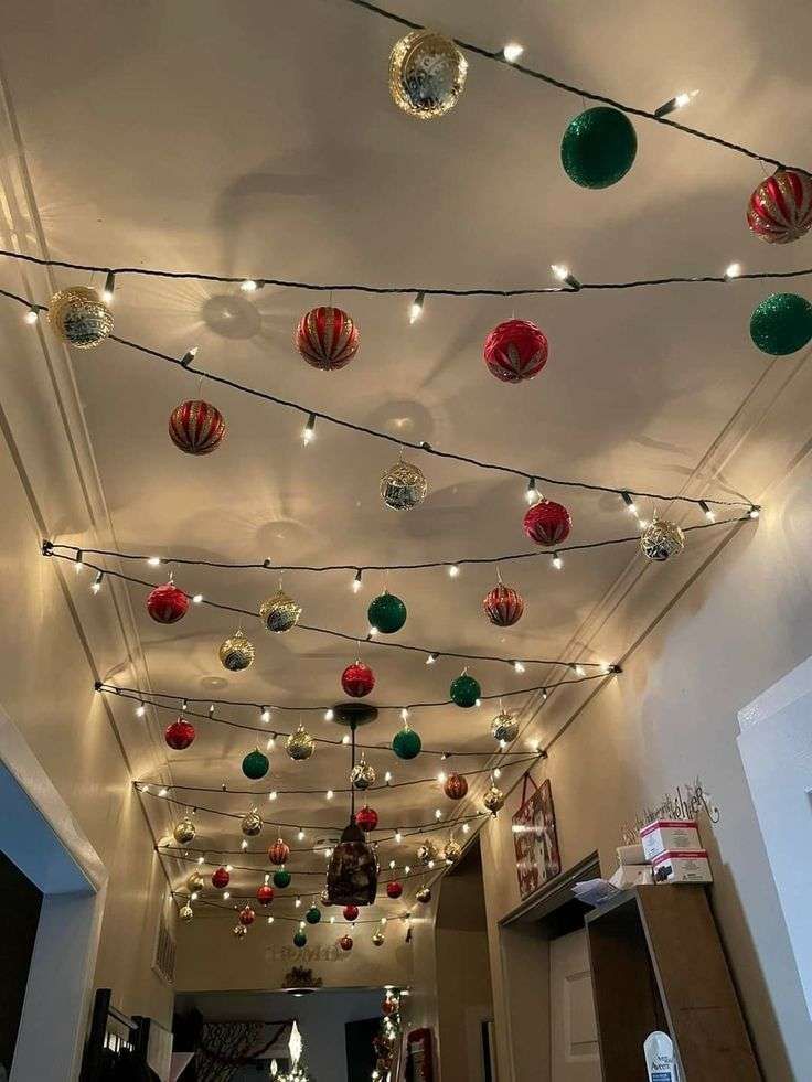 Hallway ceiling lined with a continuous strand of warm white fairy lights, creating a star‑like canopy.