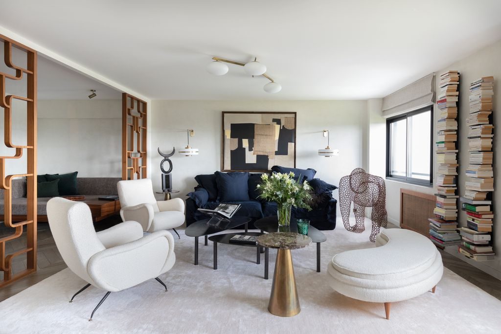 Earthy small living room filled with amber decor accents, clay ceramics, layered linen cushions.
