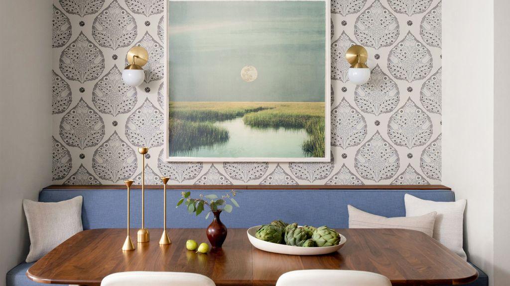 Mid-century small living room featuring tapered leg loveseat sofa and warm brass floor lamp.