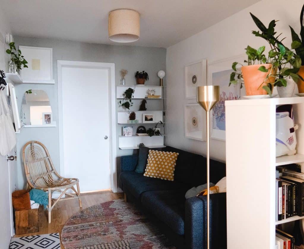 Small living room featuring an apartment-sized corner sectional sofa tucked neatly into room angle.