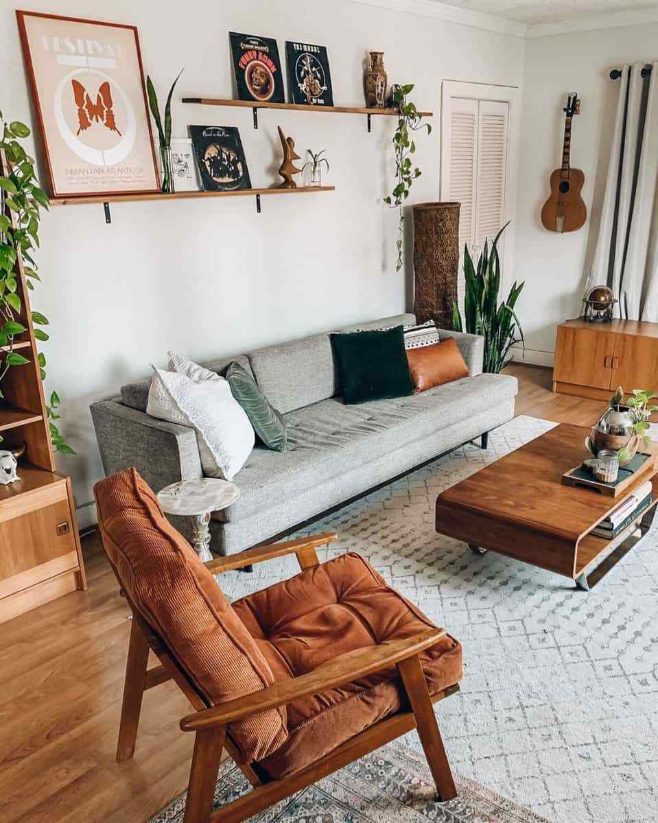 Small living room bay window styled with custom built-in bench seating and lush potted plants.