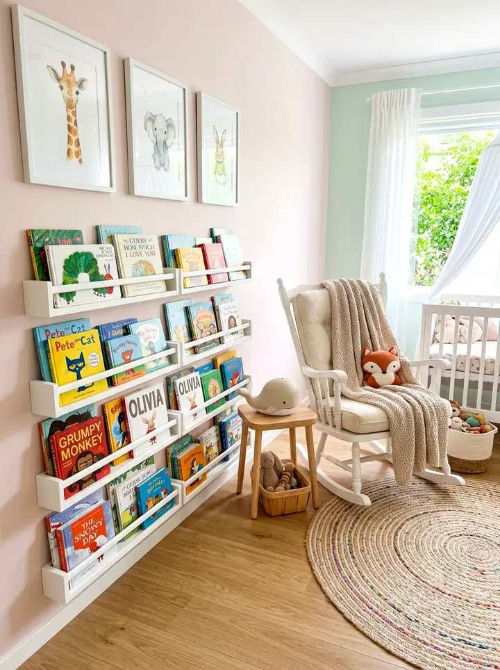 White rocking chair, pastel wall mural, soft rug, stuffed animal basket, gentle ceiling light.