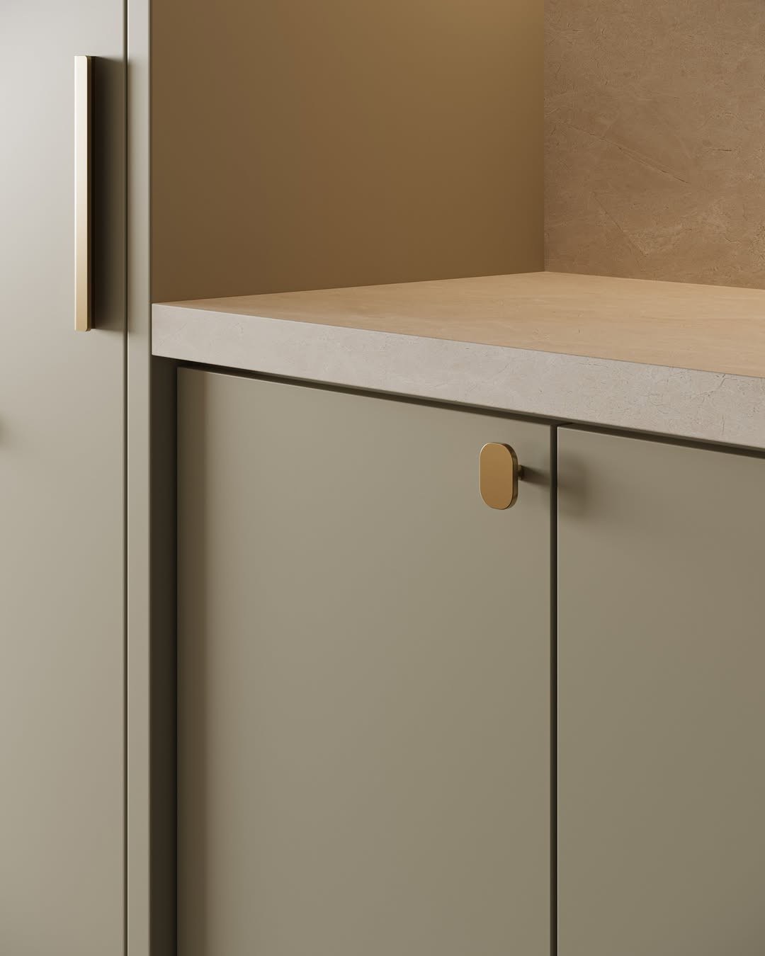 Sleek gold edge pulls on sage green kitchen cabinets for a modern minimalist look.