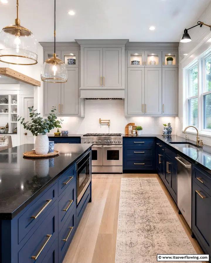 Kitchen with charcoal lower cabinets and light gray upper cabinets, white quartz countertops.