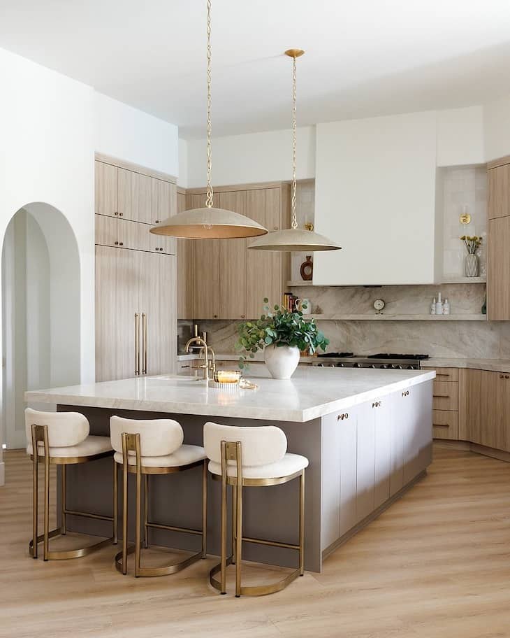 Transitional kitchen with blue-gray cabinets, subway tiles, and farmhouse sink.