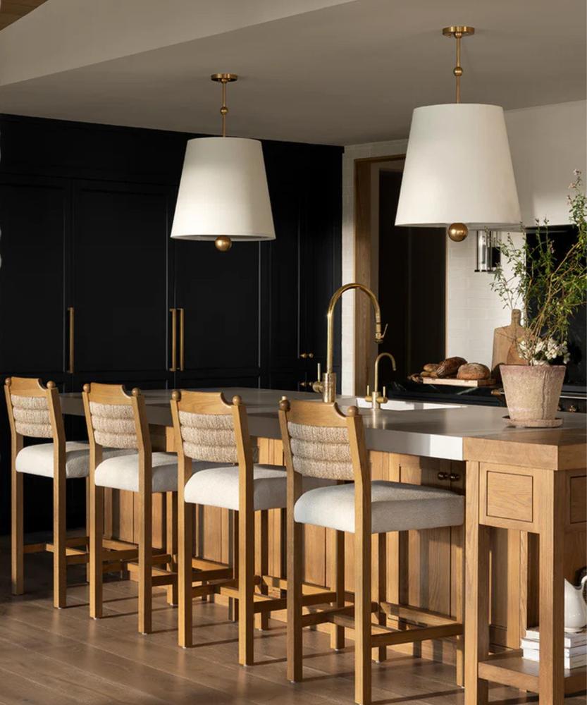 Kitchen with retractable cabinet doors hiding a toaster, blender, and coffee maker.
