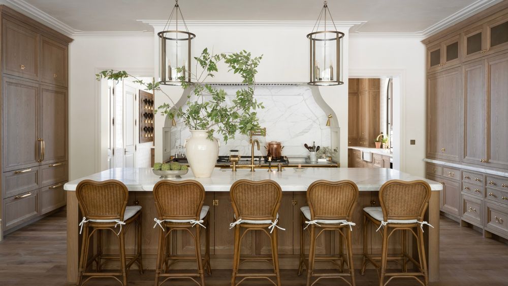 Kitchen with a faded vintage Persian runner on hardwood floors, white cabinetry.