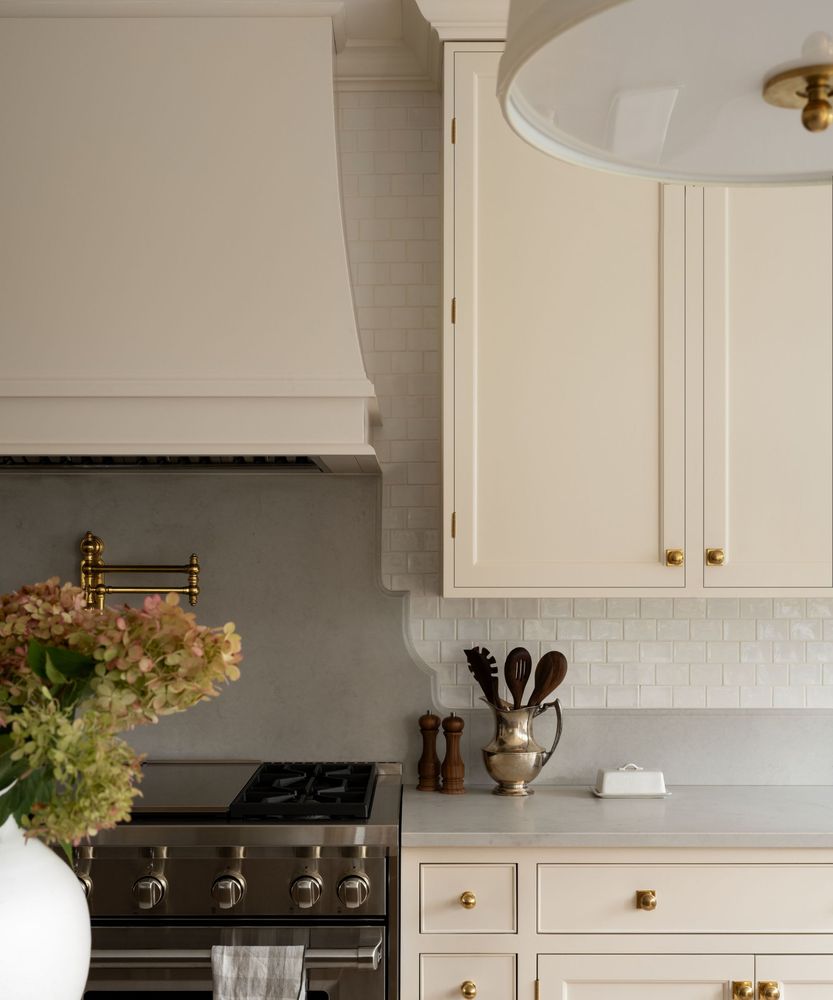 Minimalist kitchen with seamless cabinetry hiding the refrigerator and dishwasher for a clean look.
