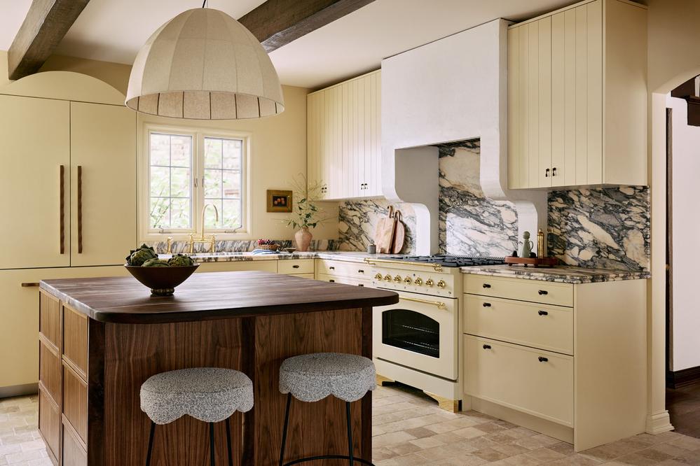 Kitchen featuring black steel frame window accents and industrial-inspired design elements.