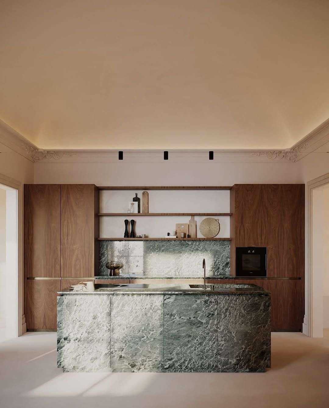 Rustic farmhouse kitchen island with a large stone trough sink, distressed white painted wood, and brass faucet.