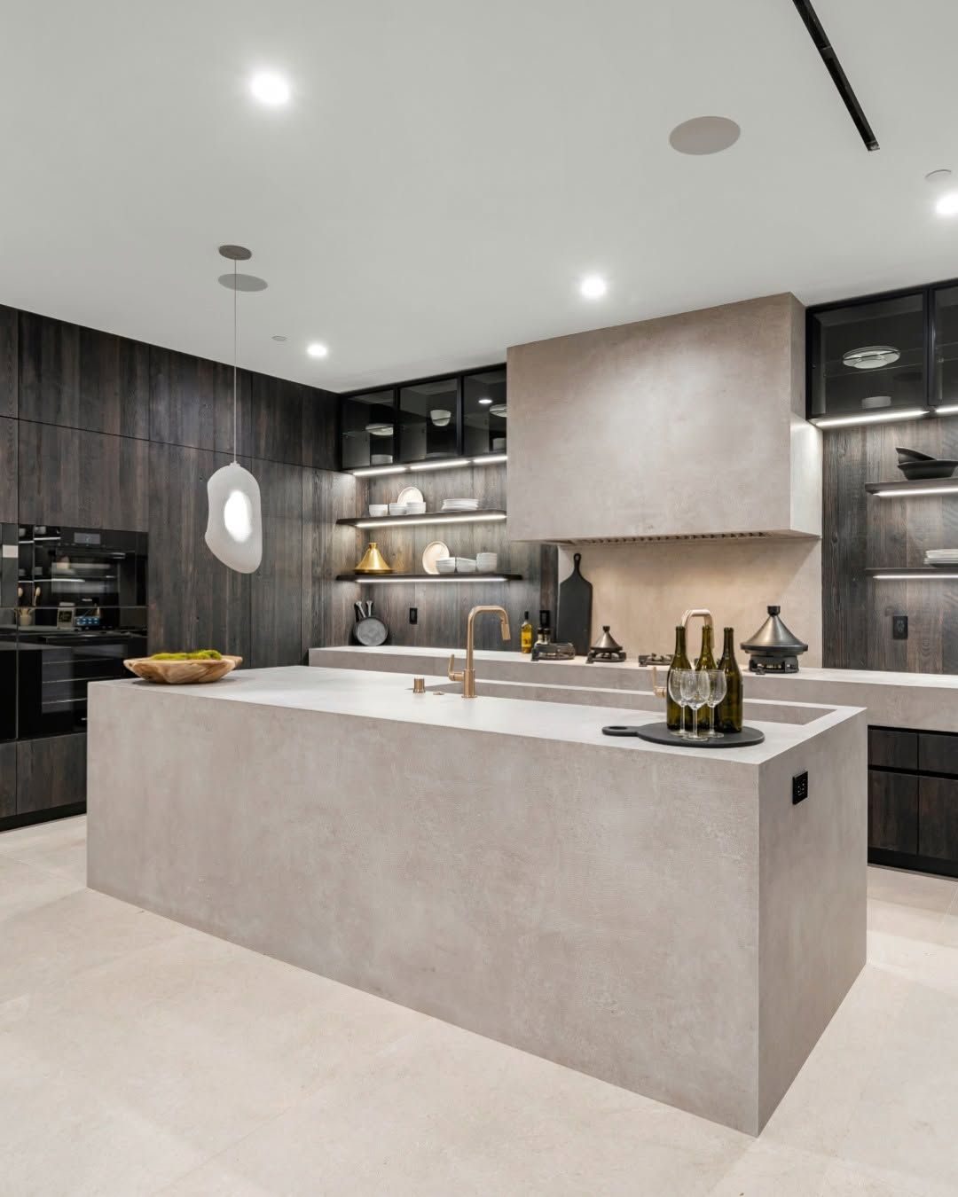 Coastal kitchen with light bleached oak island base, sea-foam green accents, and white quartzite top.