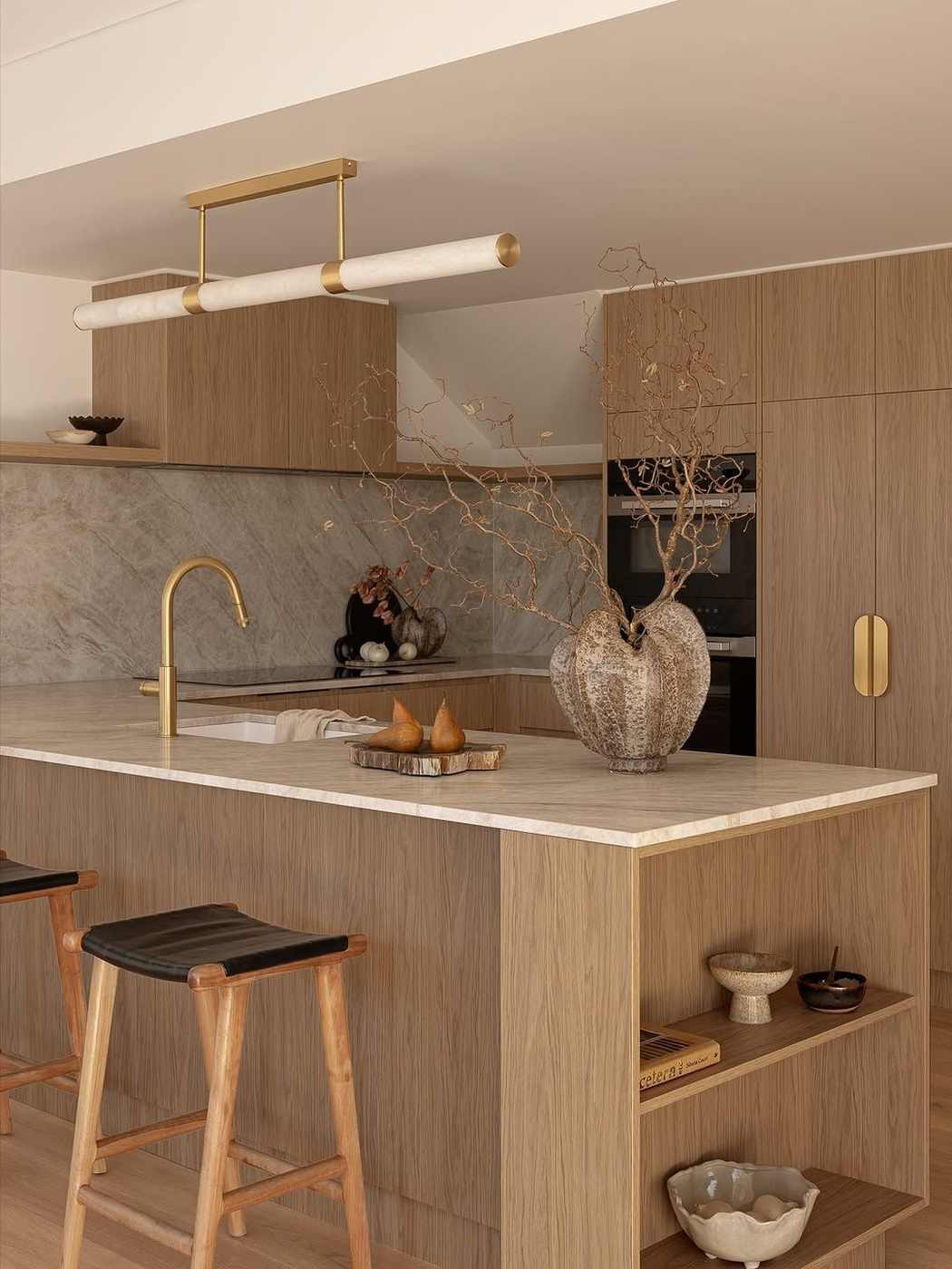 An industrial style kitchen island with black powder-coated steel frame and thick oak top.