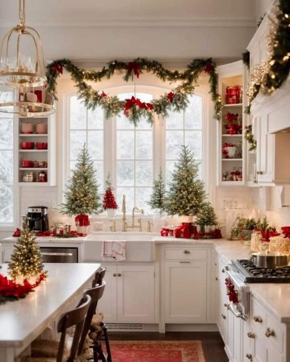Kitchen window dressed with frosted glass decal and small wreath on the sill.