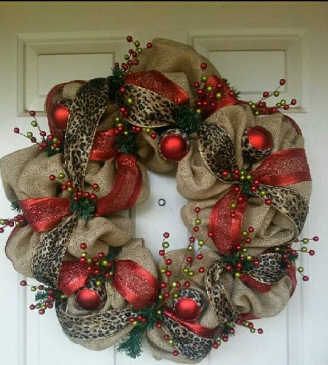 Trendy front door displaying burlap wreath layered with stylish leopard print ribbon accents.