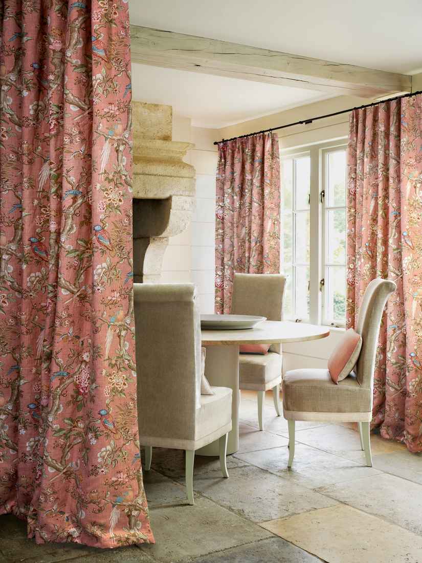Living room curtains with subtle geometric patterns in grey and cream tones.