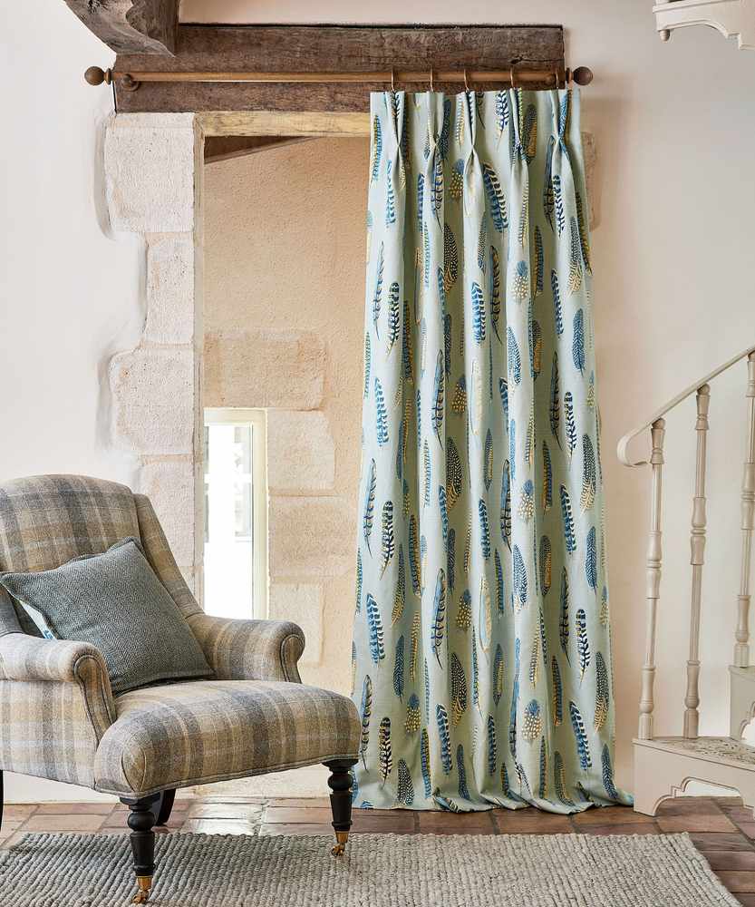 Textured rustic burlap curtains in a cozy farmhouse style living room.