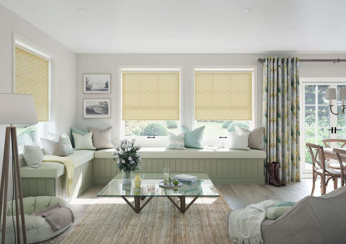 Living room curtains featuring large scale green botanical leaf prints.