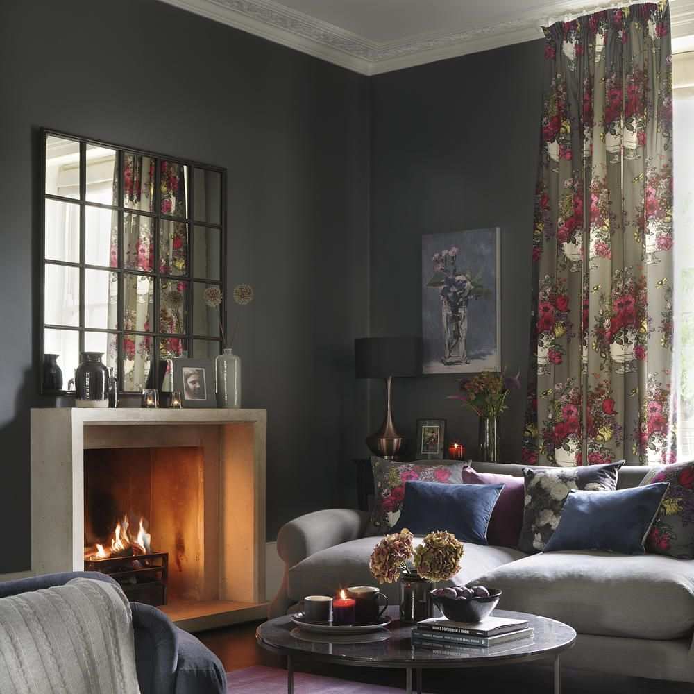 Plain black curtains in a sleek minimalist modern living room.