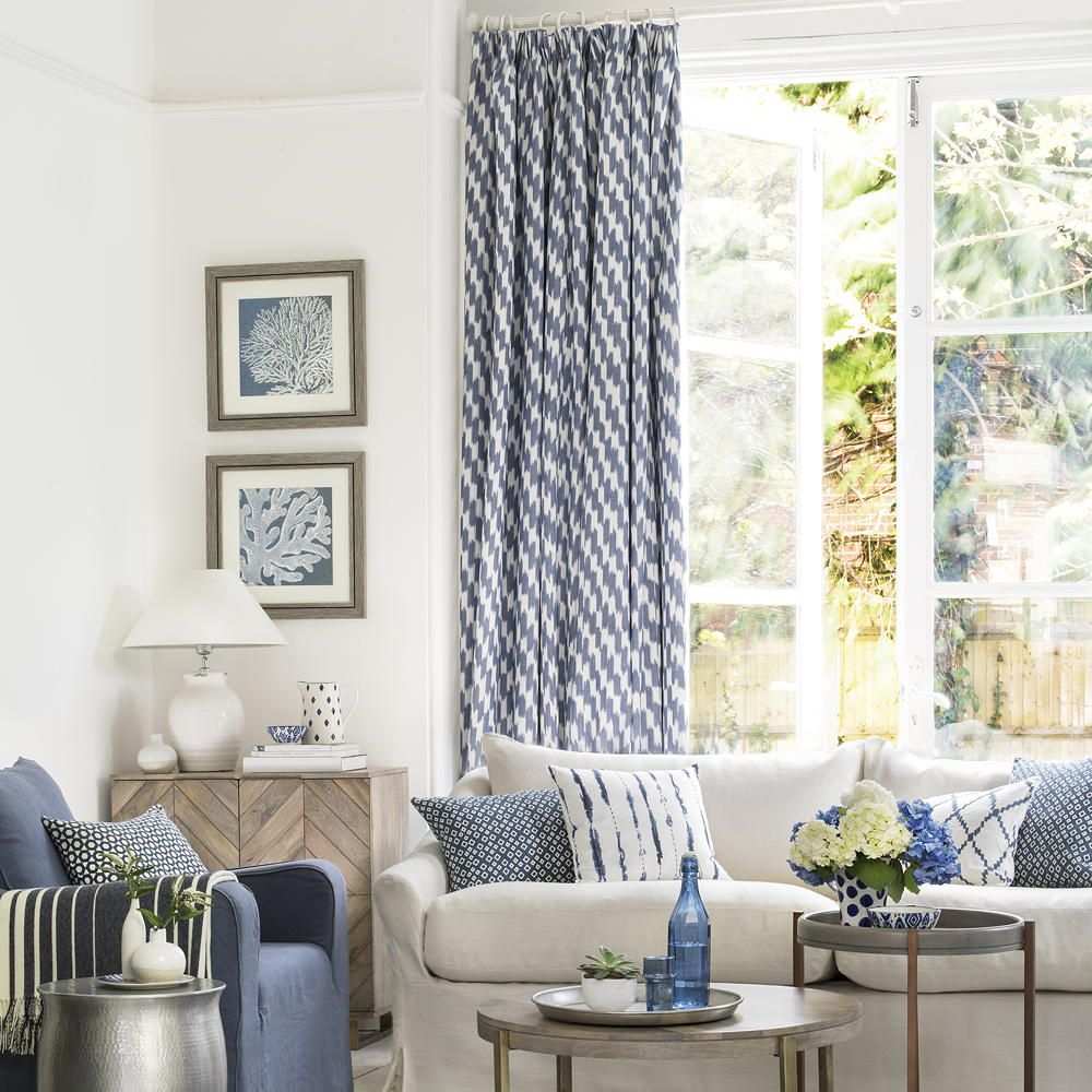 Modern curtains with a subtle metallic gold thread in a luxury living room.