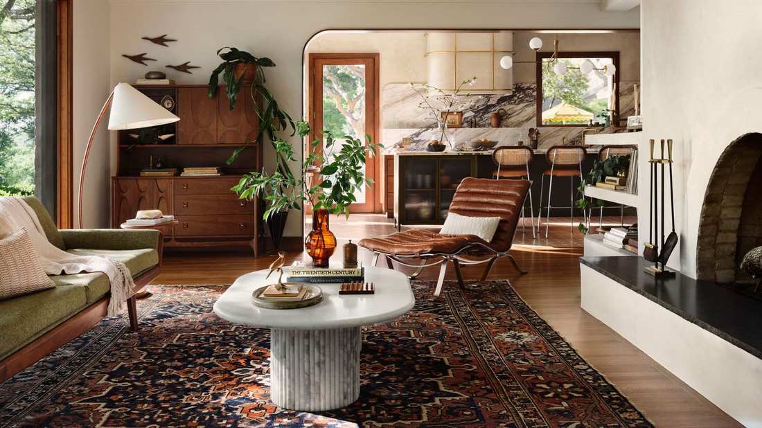 Classic curtains held back with decorative fabric tiebacks in a traditional living room.
