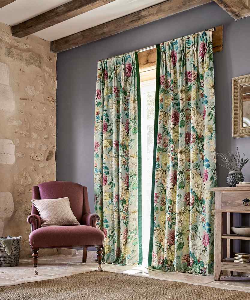 Shades of grey curtains layered in a monochromatic living room design.