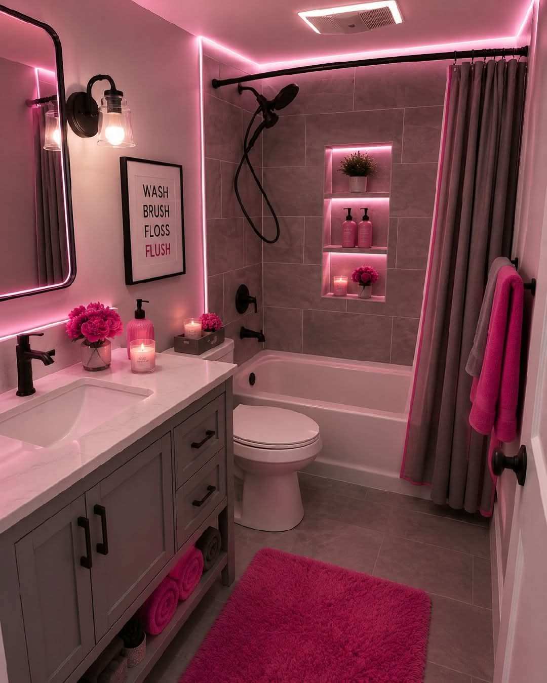 Contemporary bathroom with slate grey tiles, hot pink LED strip lighting, floating vanity, and glass partitions.