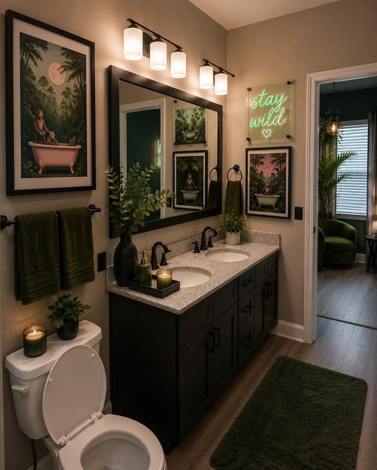 Bathroom showcasing a deep emerald double vanity, matte black countertops, white subway tiles, and soft teal lighting.